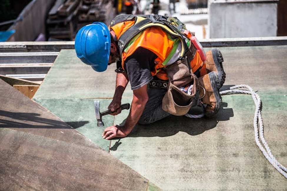 man working on roof