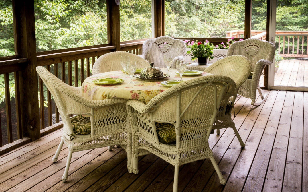 screened porch with table and chairs