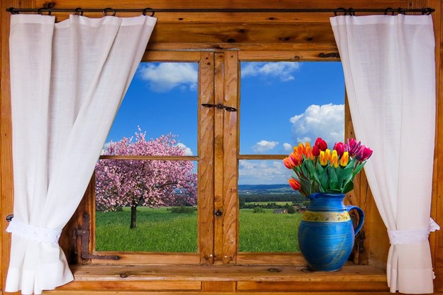 white curtains on window with view of pretty landscape