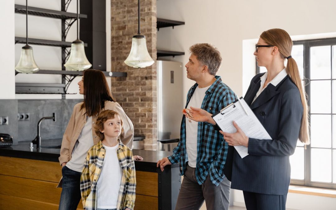 a family being shown a home by a realtor