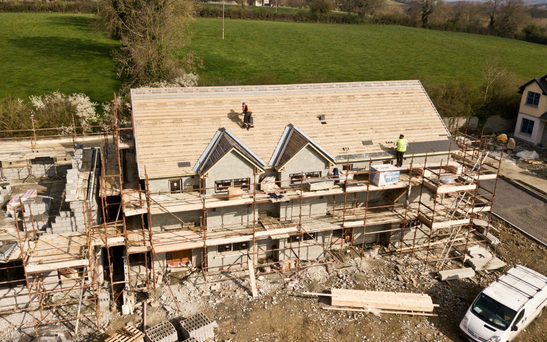 Aerial Photo Of Brown 3-story House being built