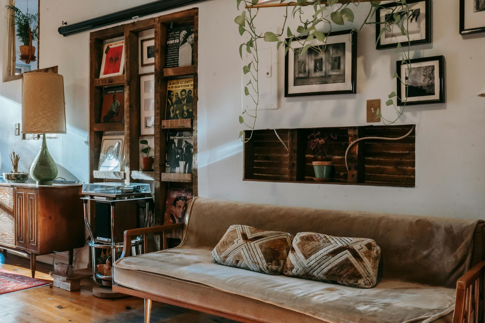 cozy futon couch in a plant filled room
