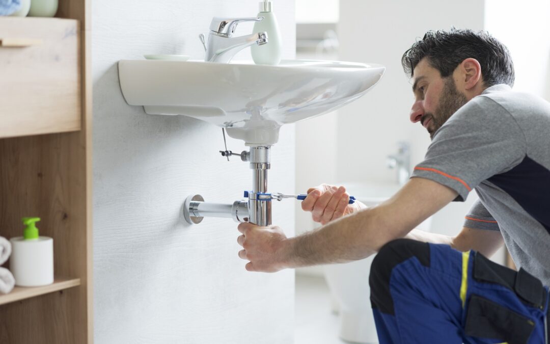 Plumber working on a sink