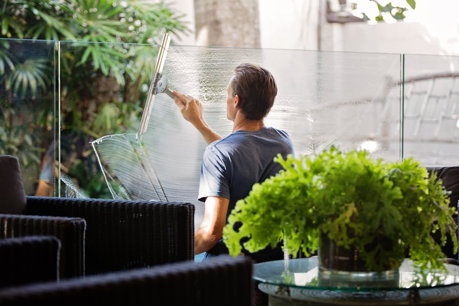 Man cleaning glass