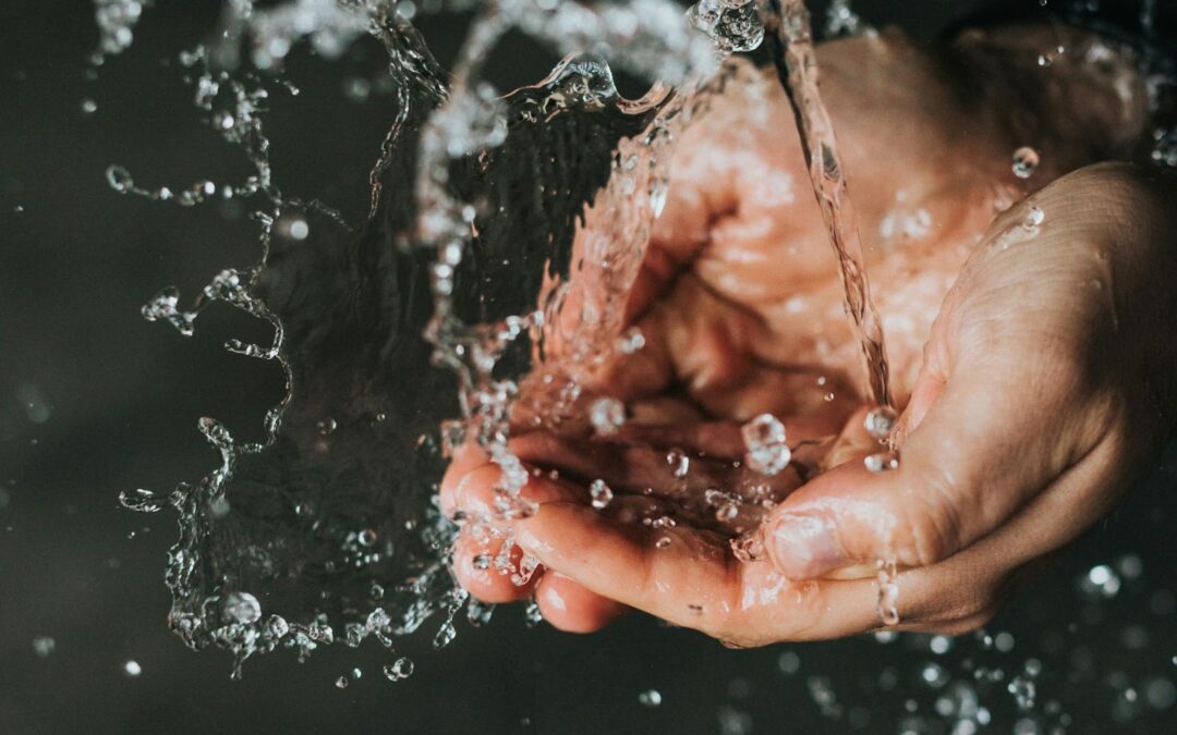 cupped hands getting water