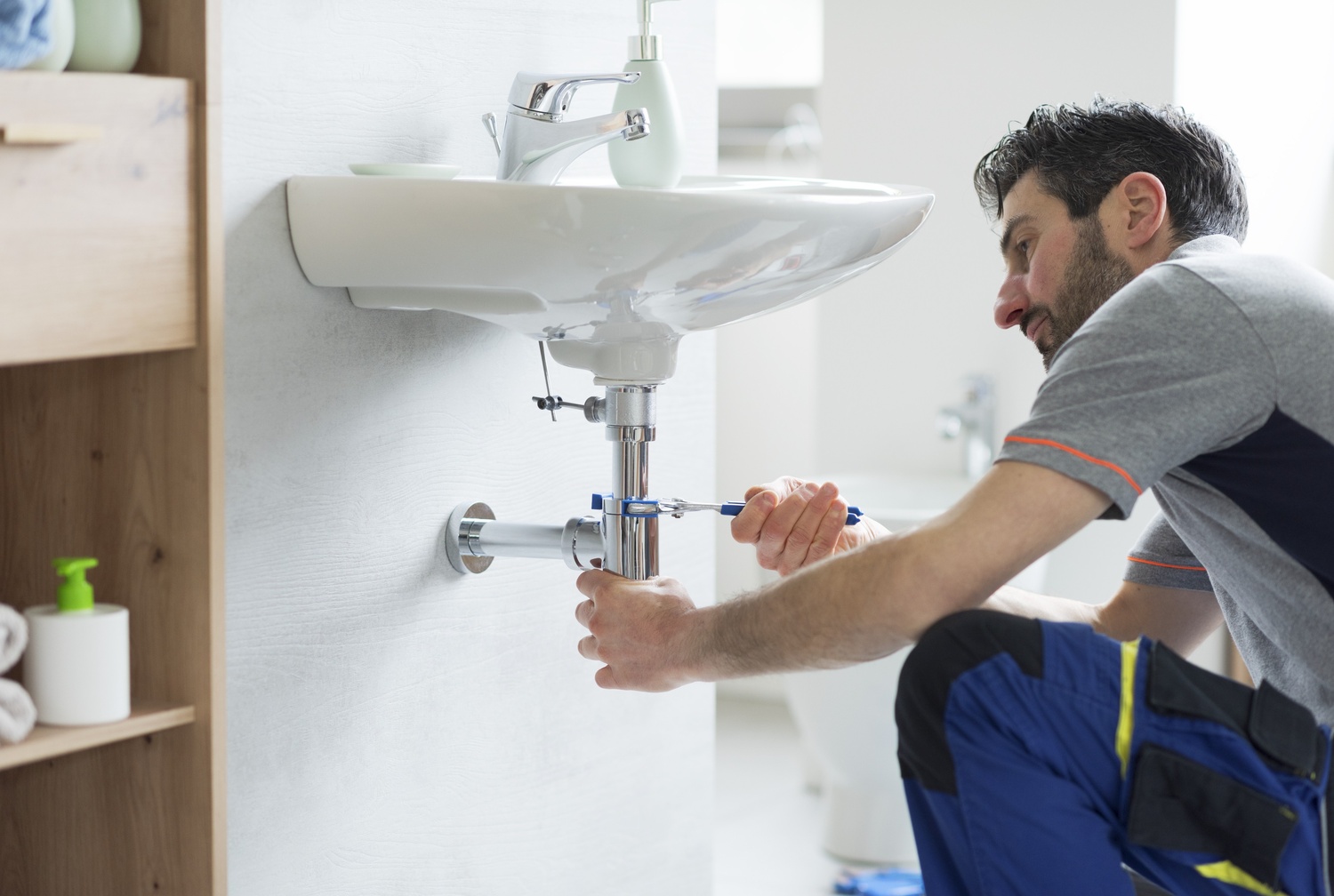 Plumber working on a sink