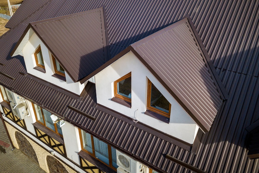 Close-up aerial view of building attic rooms exterior on metal s