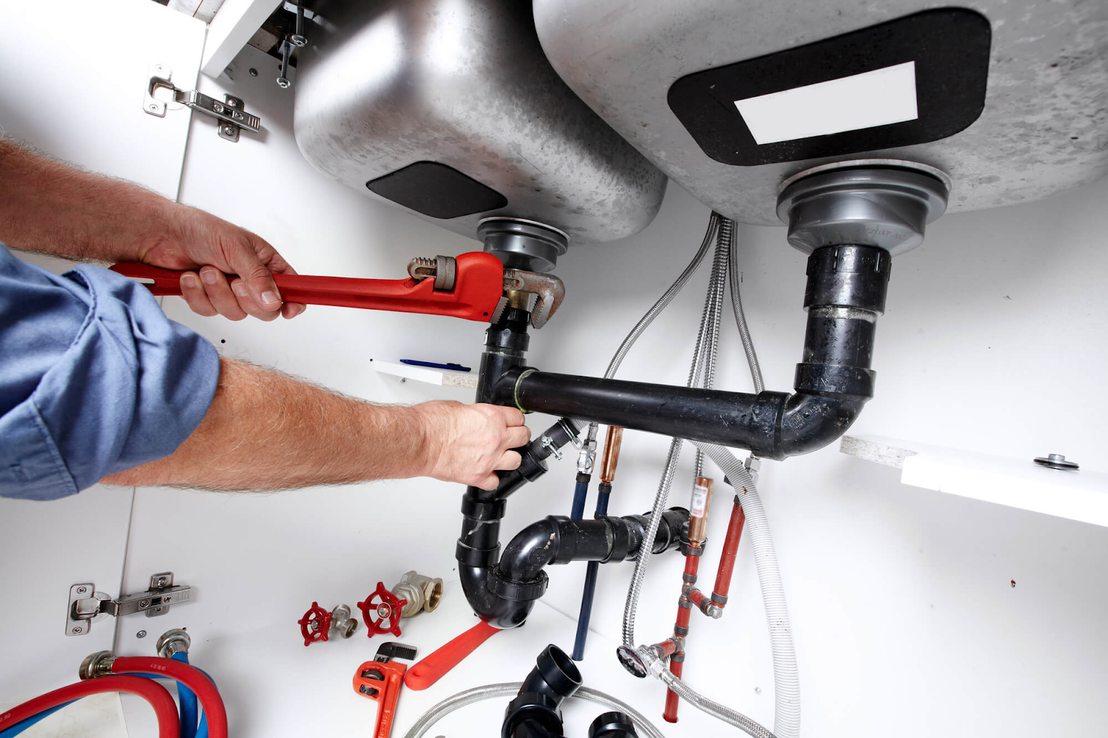 Plumber Working Under a Sink