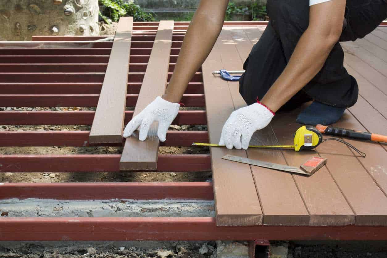 Construction worker installing an outdoor patio