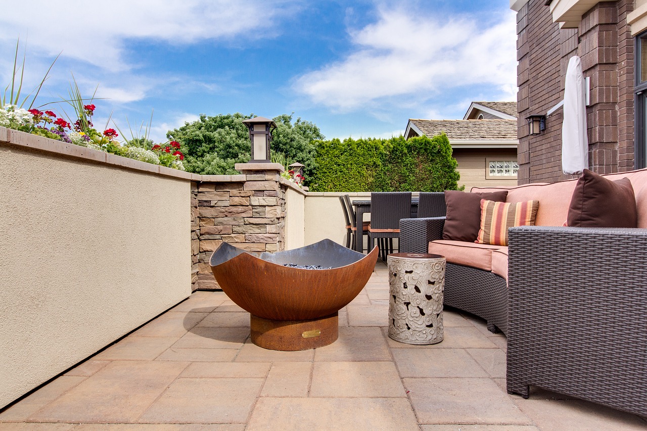 large copper fire bowl in backyard