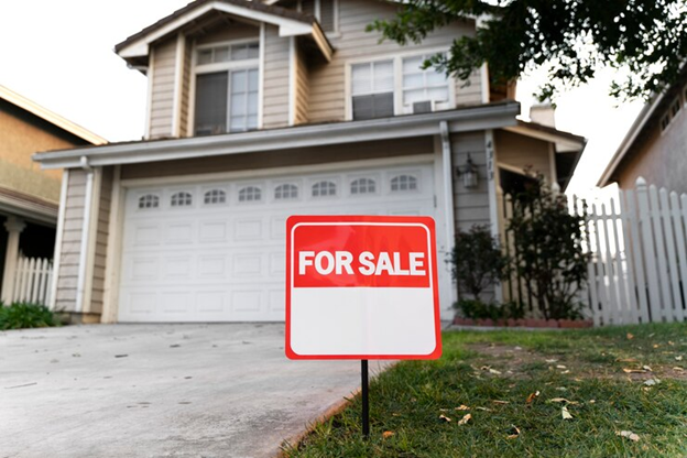 yard sale house with yard sale sign