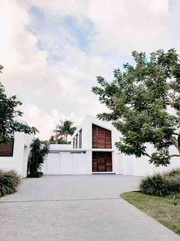 modern white house with driveway modern architecture home with concrete driveway