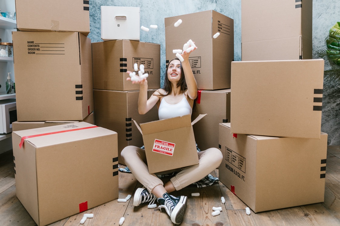 young woman amongst moving boxes