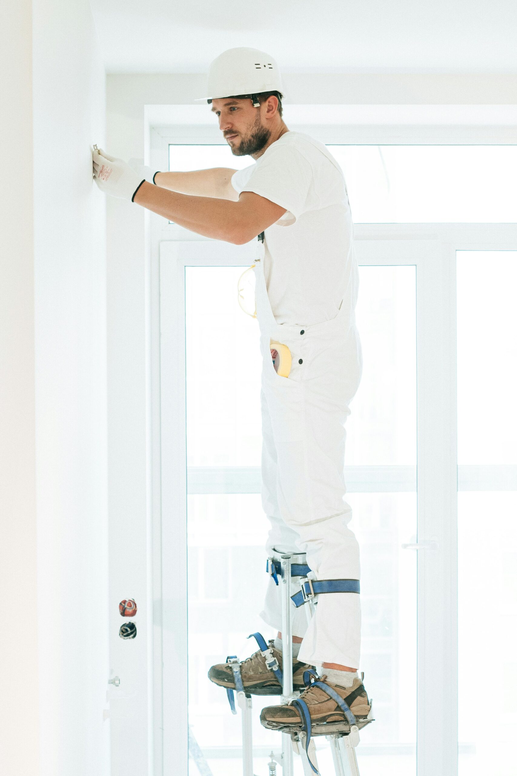 manpainting A professional painter applying paint with precision to a wall