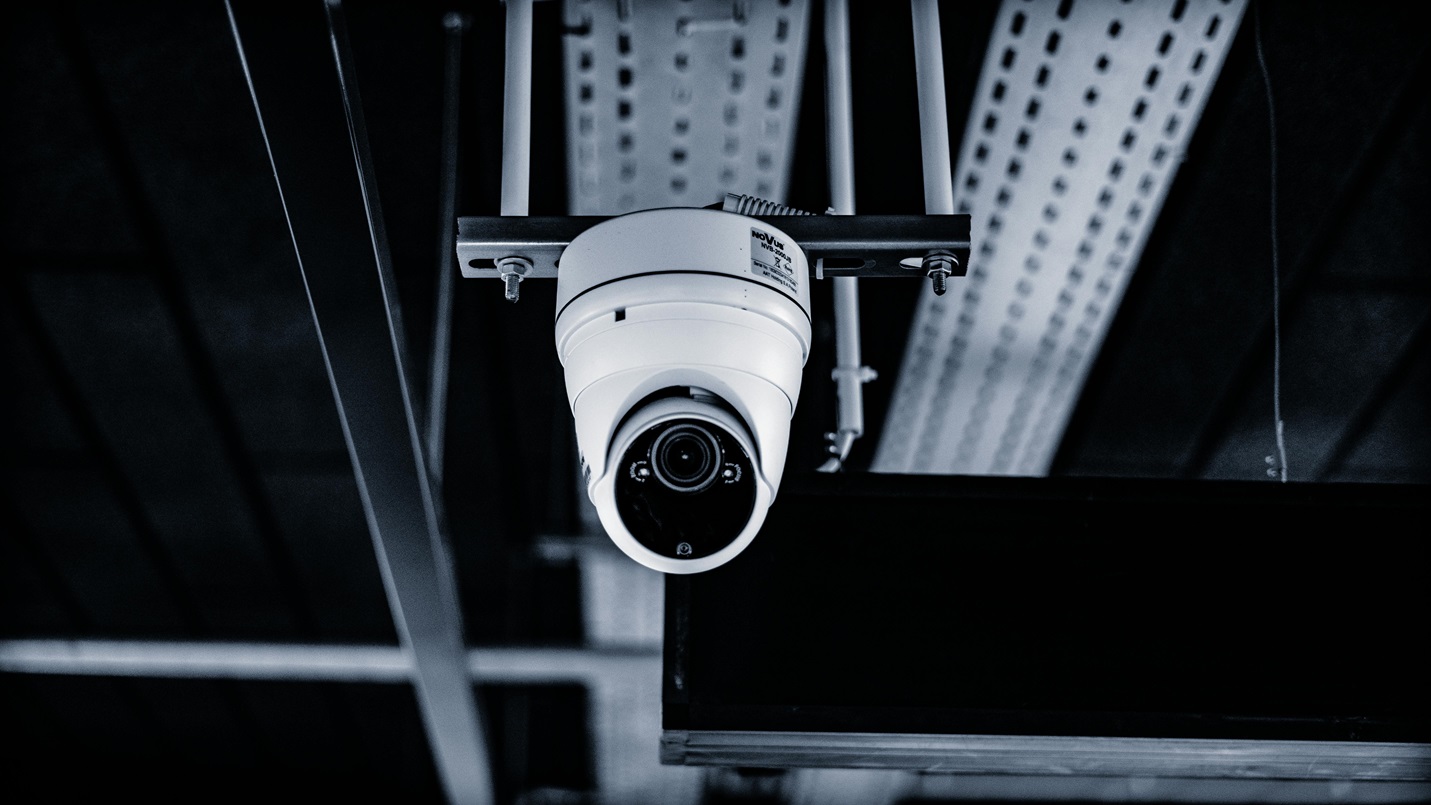 security camera outside security camera on side of building