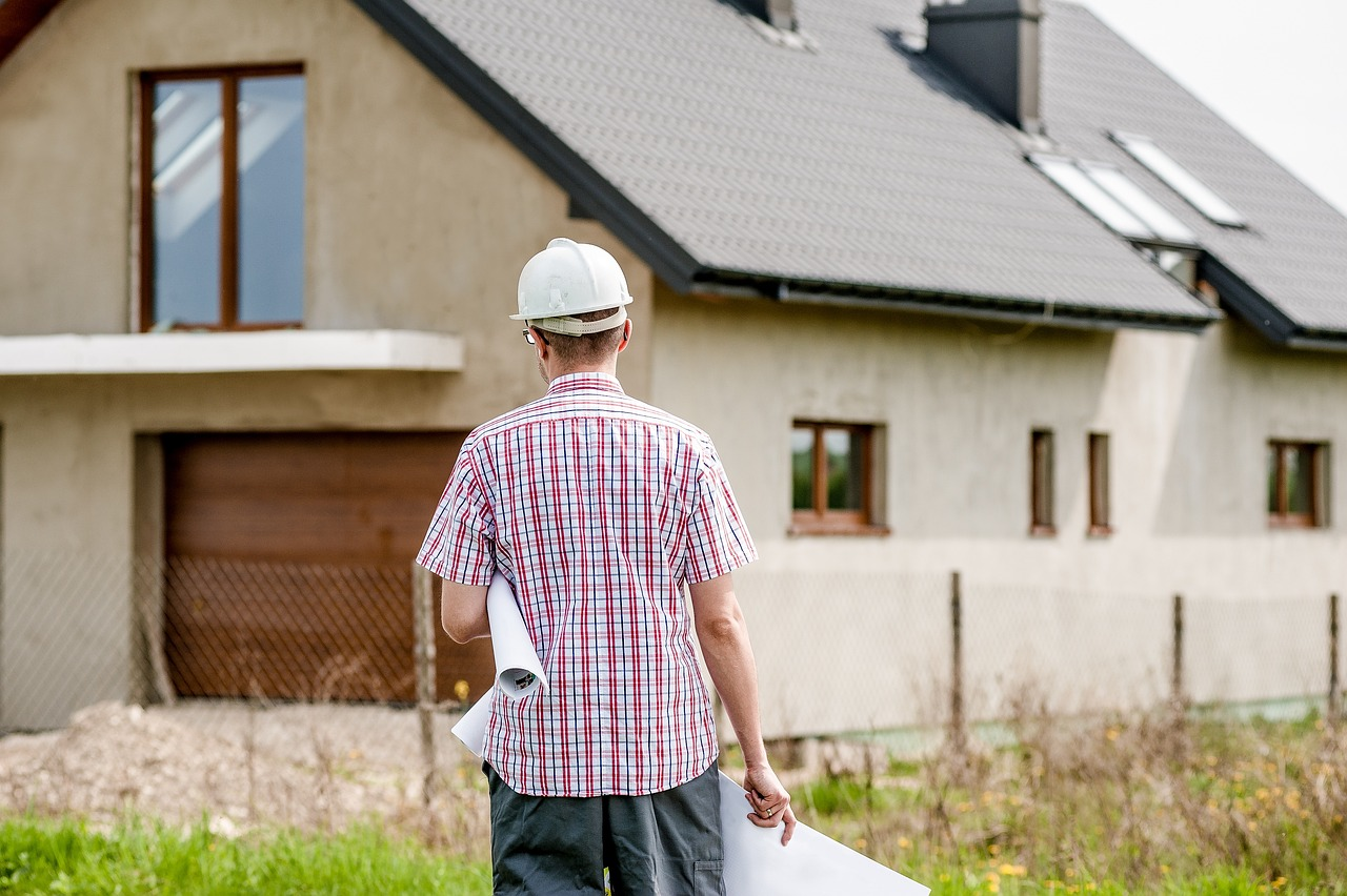 architect walking towards house
