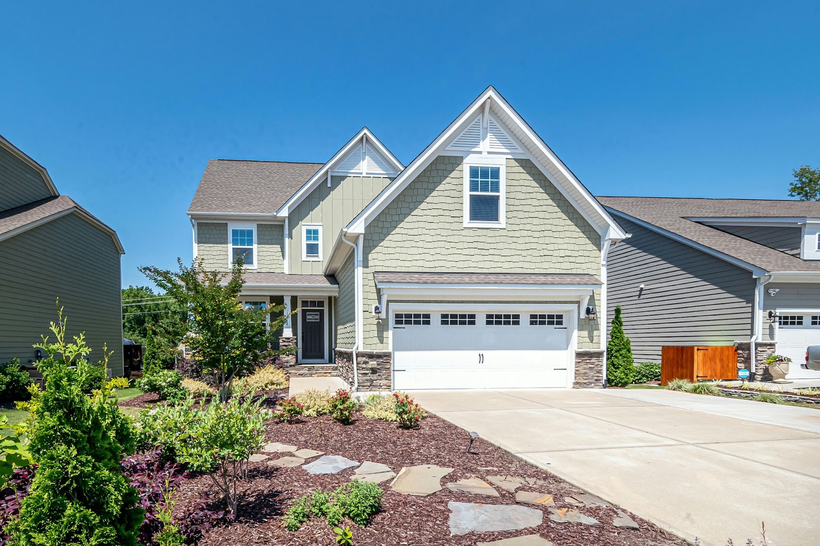 warm-home image of a beautiful large home on a sunny day